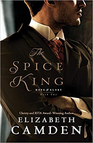 The Spice King by Elizabeth Camden shows a businessman dressed in a black suit and a burgundy tie. A new release from Bethany House in 2019